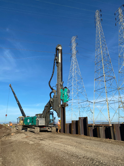 Sheet piles are installed along the levee