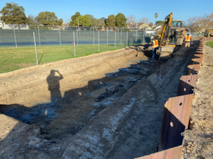 Construction crews dig in the ground